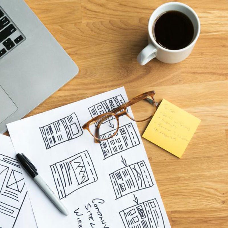 Designer's Desk With Coffee And Wireframes Photo / Photo by: Sarah Pflug