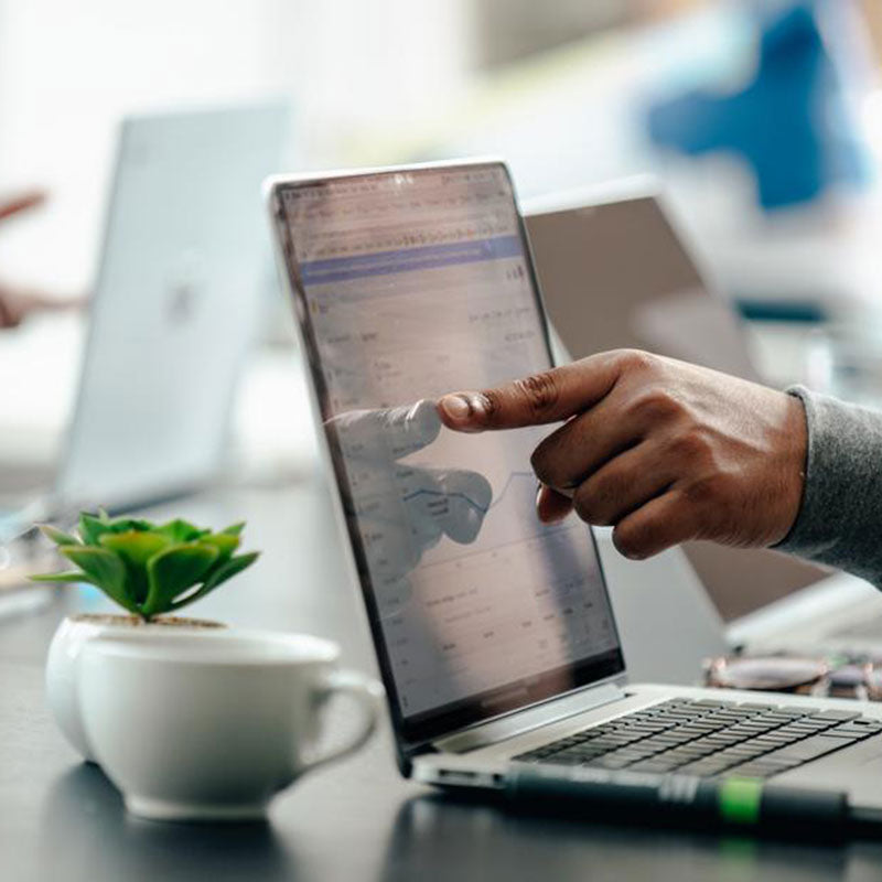 Hand pointing to a screen on a laptop // Photo by: Matthew Henry